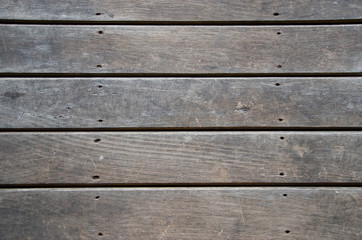 Old wood floor with blurred patterned background