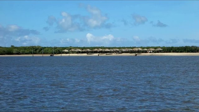 Private river beach, huts and trees, at Sergipe, Brazil