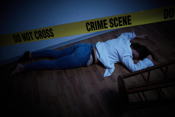 crime scene - woman lying dead on the floor