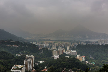 Obraz premium View from Rocinha favela, also known as a slum or shanty town, built between a steep mountain valley in the South Zone of Rio de Janeiro, Brazil, South America