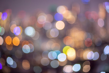 Fototapeta premium Bokeh light in the fastival in the evening at Bangkok , Thailand. Abstract bokeh yellow light of the city in night time and soft color.