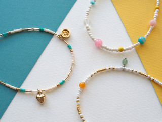 Bracelet and Necklace : Mixed beads with various materials  isolated on color paper