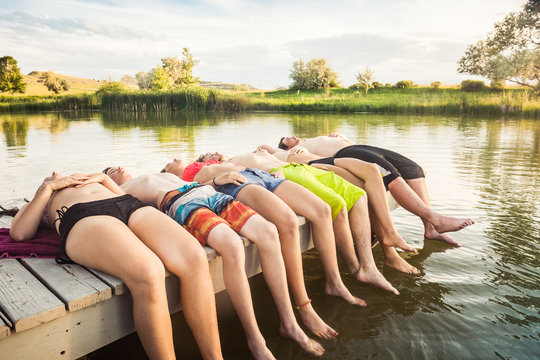 Group of friends relaxing and having fun at a swimming hole. Bridger, Montana, USA