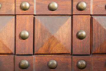 close up of antique wooden door with studs
