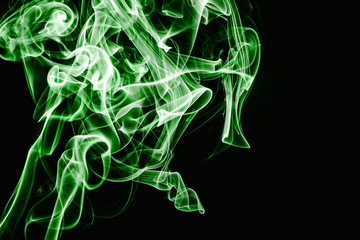 Fototapeta premium Green smoke isolated on black. Gas flow shape effect. Artistic color scent mist background. Empty copy space magic fume.