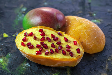 ice cream with mango pulp, garnished with pomegranate berries, Spanish ice cream in frozen mango...
