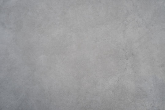 Texture of a smooth gray concrete wall as a background
