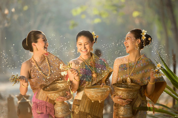 Thai girls and laos girls splashing water during festival Songkran ,Thailand
