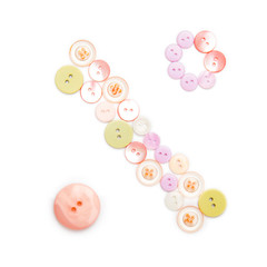 Symbol % from pink and green buttons isolated on white background. Sewing kit. Colorful buttons, stylish alphabet for handmaking hobby. Handmade sew abc. Text from buttons. Sale of sewing furniture