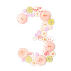 number 3 from pink and green buttons isolated on white. Sewing kit. Colorful button number three, stylish alphabet for handmaking hobby. Handmade sew abc. Text from buttons. Sale of sewing furniture