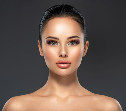 Front portrait of the woman with beauty face - isolated. Beauty face of the young beautiful girl with a healthy skin.  Skin care concept.