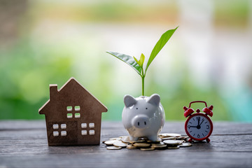 Saving money for buy a new house for plan business investment of real estate concept.