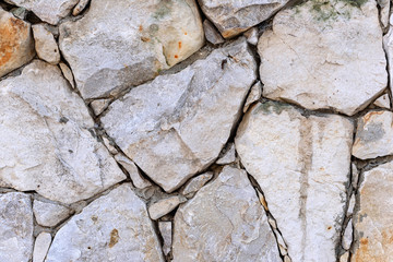 Close-up wall of wild rough stone