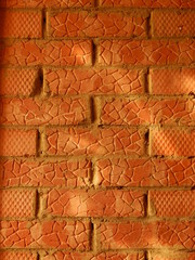 red brick wall lit by the sun