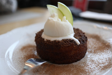 hot apple pie with ice cream and apple slices on top