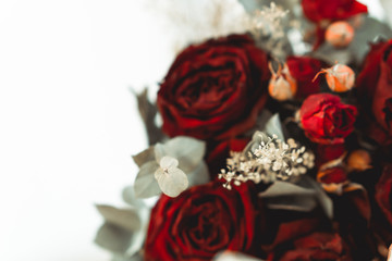 A bouquet of roses in front of a out of focus white background