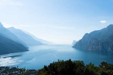 A view from above at the foggy lake garda in italy