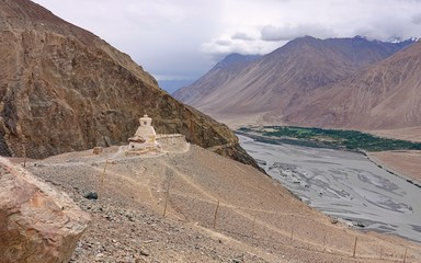 A Ladakhi stupa a mound-like or hemispherical structure containing relics typically the remains of Buddhist monks or nuns that is used as a place of meditation  2020