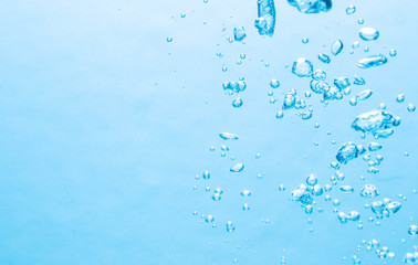 The bubbles under the blue water