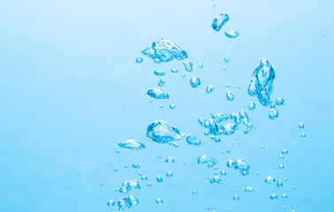 The bubbles under the blue water