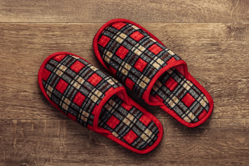 Slippers on the wooden floor. Top view