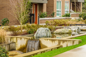 Modern apartment buildings with nice pond in Vancouver, British Columbia, Canada.
