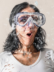 woman having a scuba mask under water