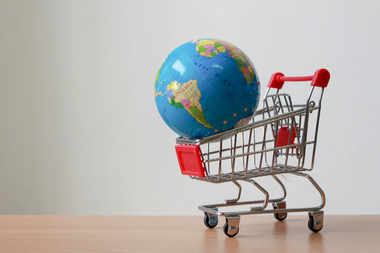 The globe on the shopping cart with copy space.