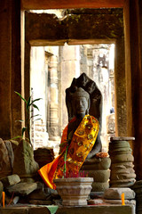 View of a beautiful statue adorned in the Bayon temple in the Angkor Thom complex