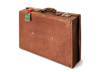 Old retro or vintage suitcase made of brown leather isolated on white background. Happy holidays tag is visible on the suitcase.