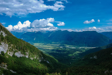 Naklejka na ściany i meble Panoramic picture of Bovec valley, taken high in the mountains, close to Kanin ski slope.