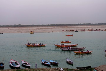 Colorful boats in the Ganges river on the Ghats of Varanasi, India 2019