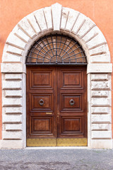 ancient wooden arched door, Italy Europe