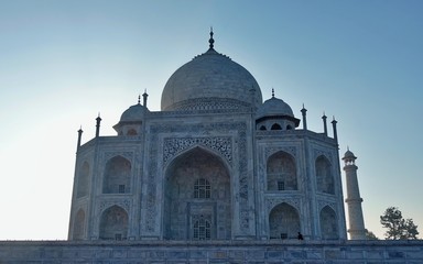 Fototapeta na wymiar Agra / India - 06.20.2019 : Fabulous Taj Mahal, A UNESCO World heritage , on a bright and blue day -