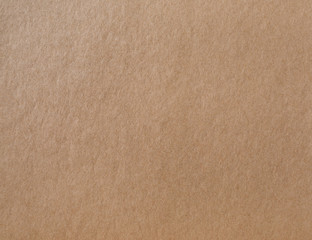 Fototapeta na wymiar Kraft wrapping paper texture. Photo of brown cardboard background.
