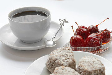 cup with spoon, apple jam in a bowl. white background.