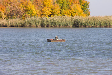 fisherman in a boat on the river