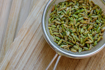 fennel seeds inside sieve brewing for healthy drink