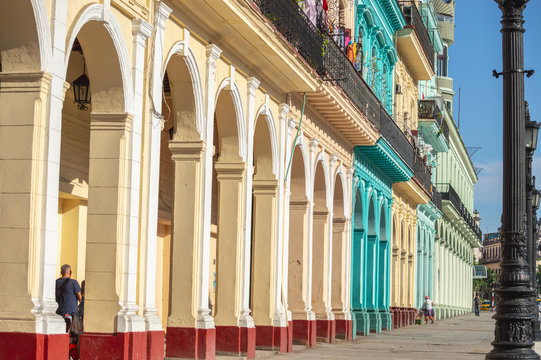 HAVANA,CUBA - MAY 4,2019 : Street scene with classic old cars and traditional colorful buildings in downtown Havana floridita capitolio plaza de la constitucion