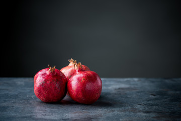 Ripe pomegranate. Pomegranate on black background. Dessert,food.