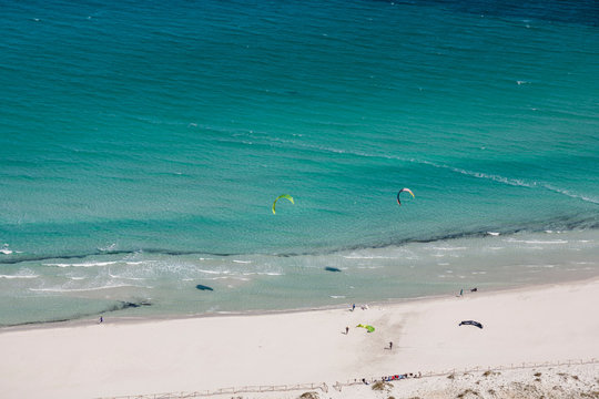 Kite surfers at amazing beach La Cinta Sardinia 