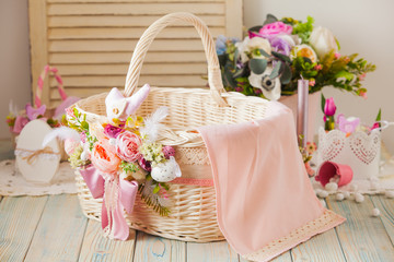 Wicker basket decorated with flowers and laces