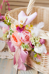 Close-up floral decor on basket. Easter holidays concept