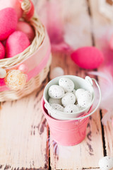 Top view tiny quail eggs in small bucket