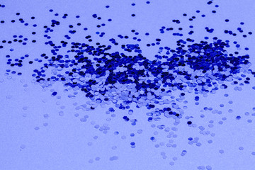 Blue festive explosion of confetti. Shape of heart. Valentine Day background.