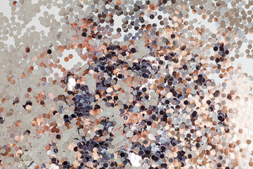Holidays background, texture. Silver explosion of confetti.