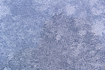 Frosty pattern on a glass surface.