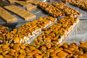 Walnut, almond and Pistachio nut bars on the table, Mediterranean sweets.