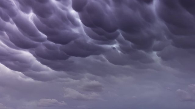 Formation of Mammatus clouds dramatic sky background, timelapse 4k