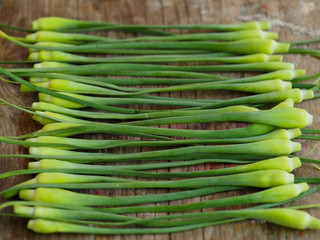 Sliced garlic sticks are very tender and delicious. They are also known as garlic spears , stems , or tops .